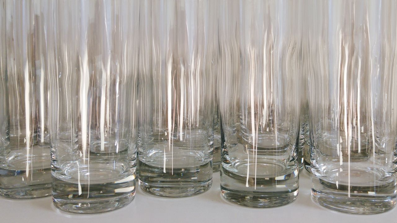 Drinking glasses on table with reflection