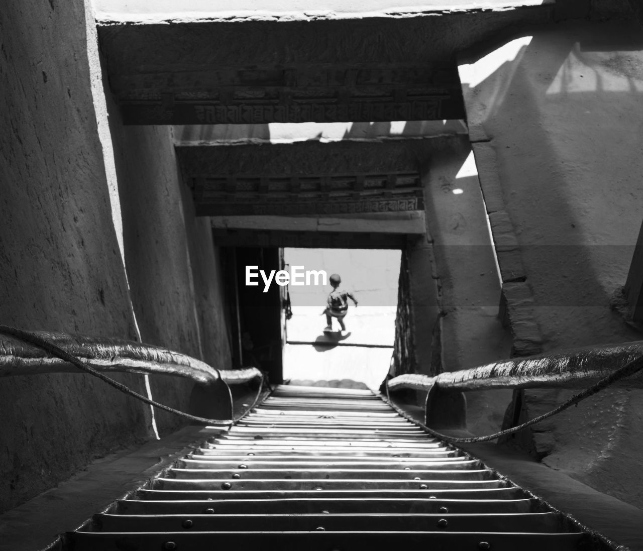 Man walking on bridge