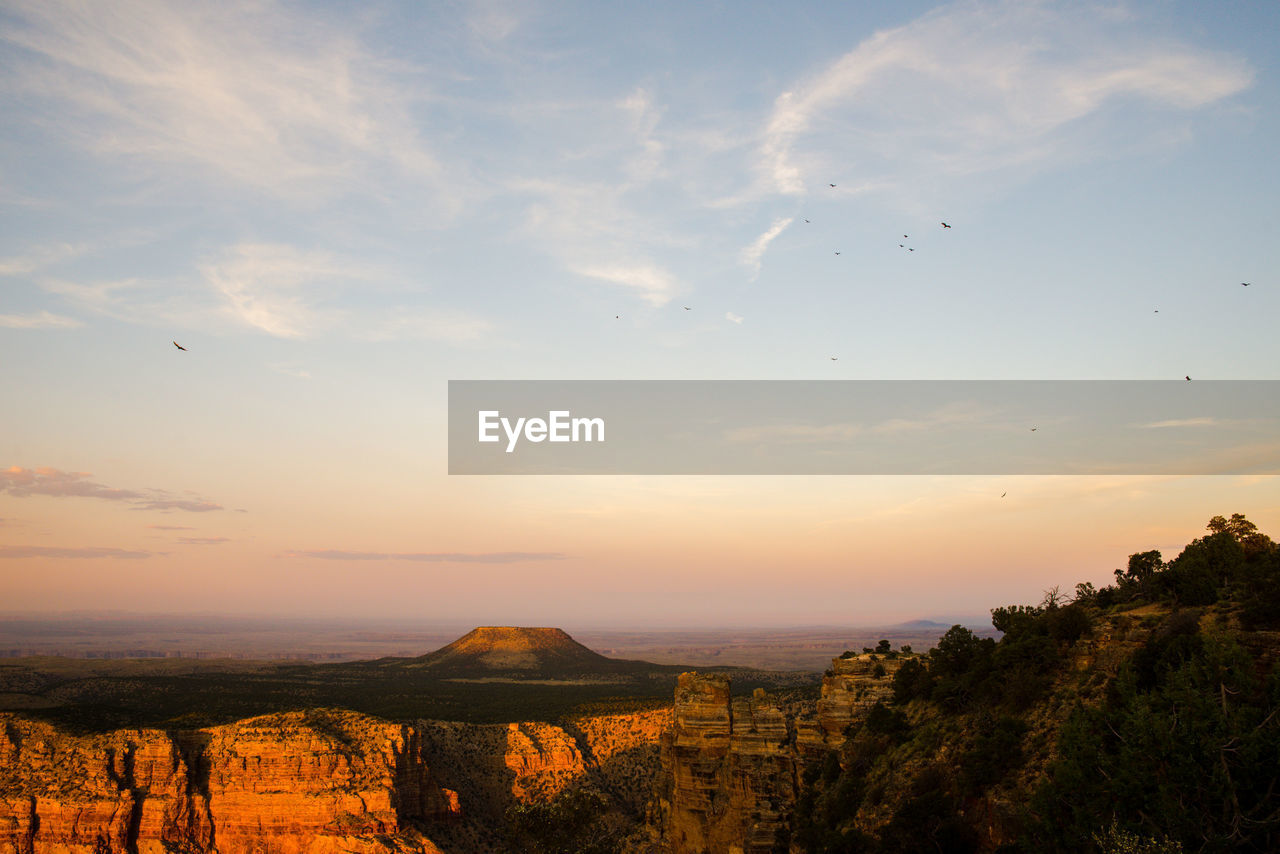 Aerial view of landscape against cloudy sky