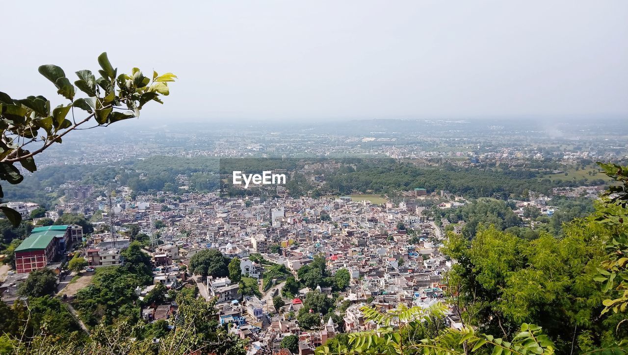 Aerial view of townscape against sky