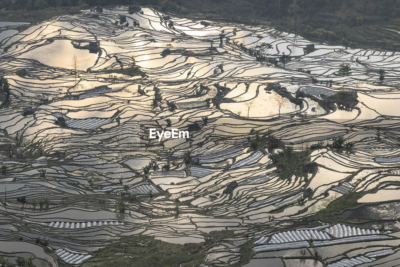 Sunset over yuanyang rice terraces in yunnan, china, one of the latest unesco world heritage sites