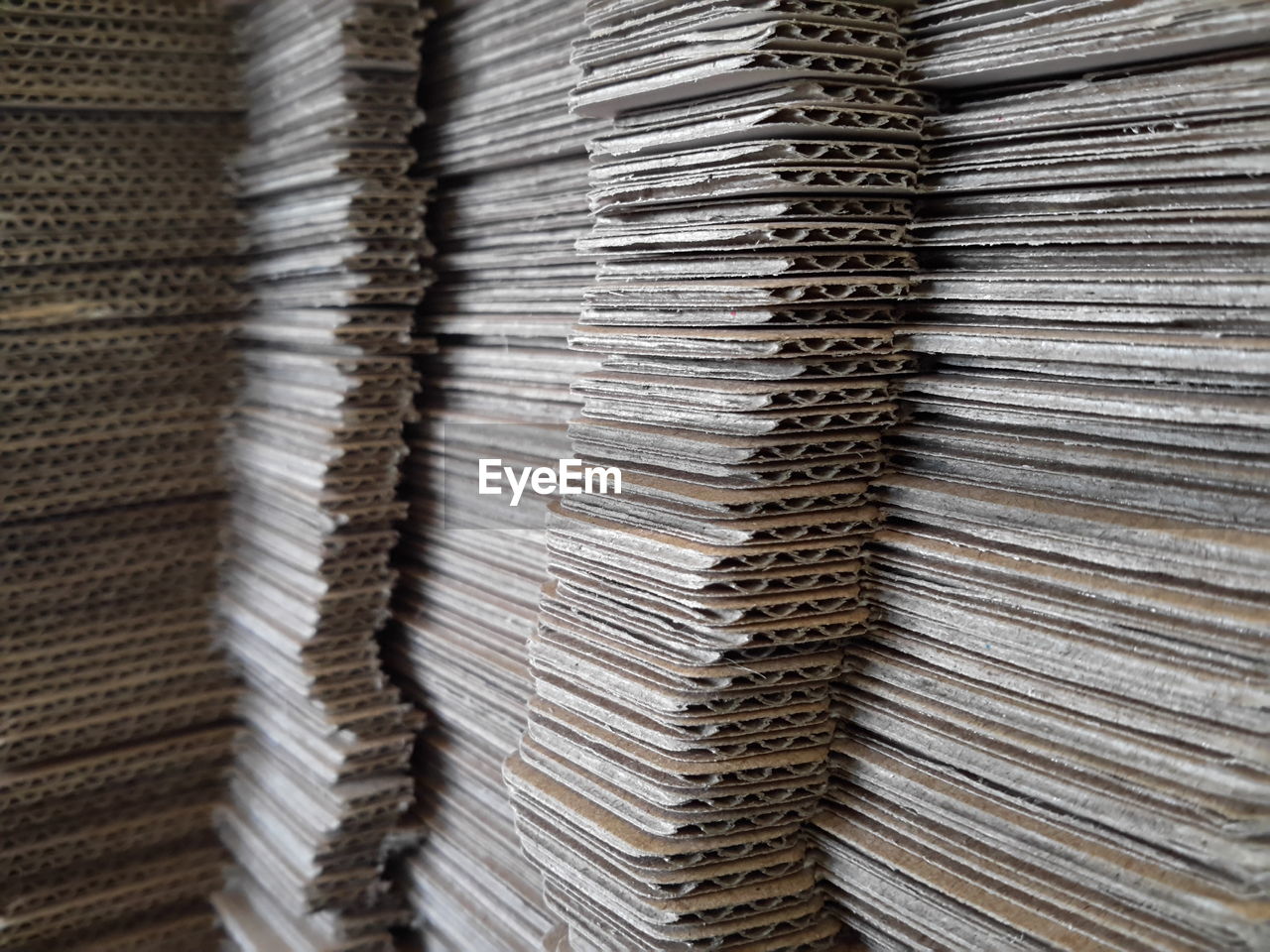 Full frame shot of stacked cardboard boxes in warehouse