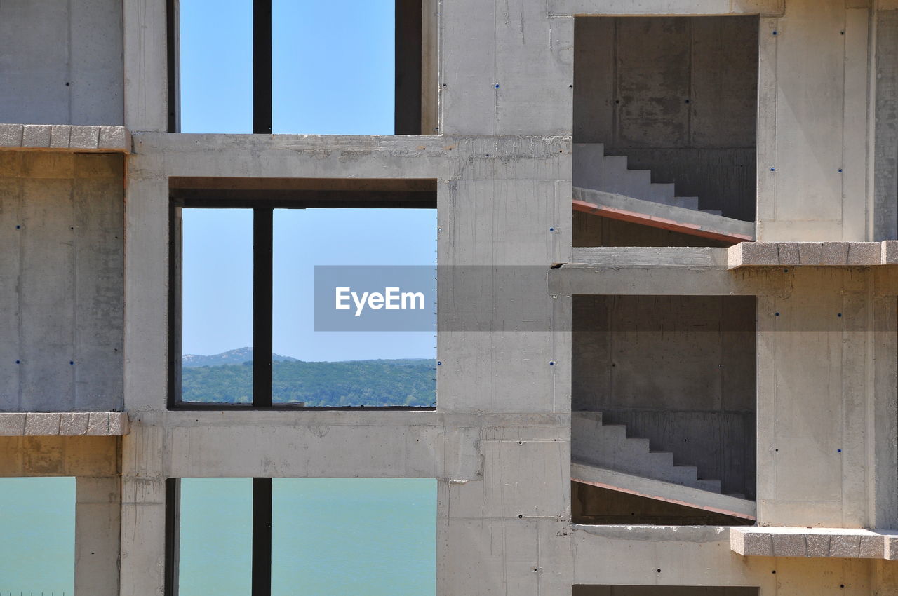 BUILDING SEEN THROUGH WINDOW