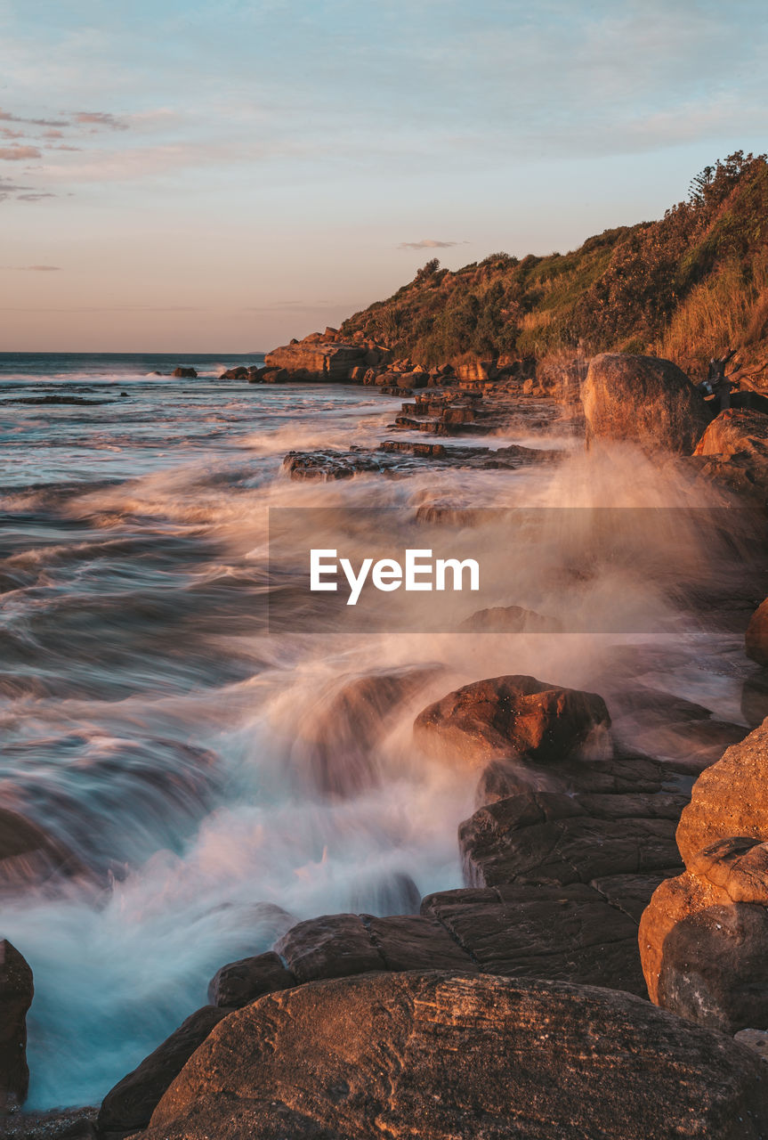 scenic view of sea against sky at sunset