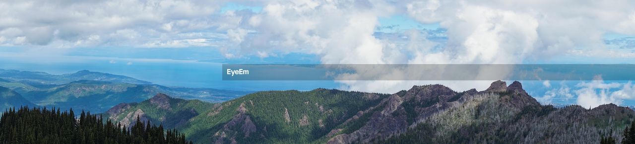 PANORAMIC VIEW OF CLOUDS OVER MOUNTAIN