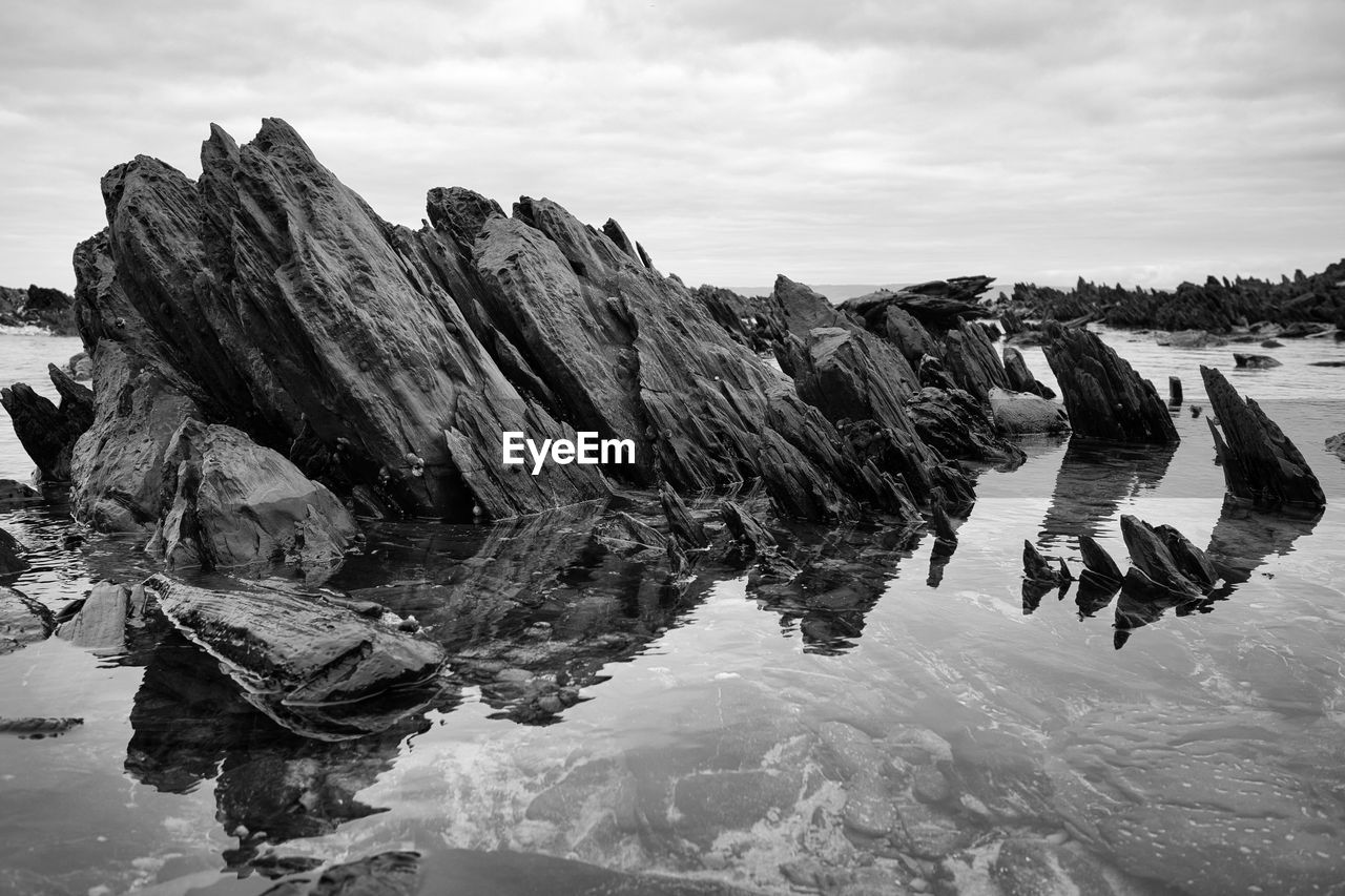 Amazing stoic rocks withstanding time, standing out of the water 