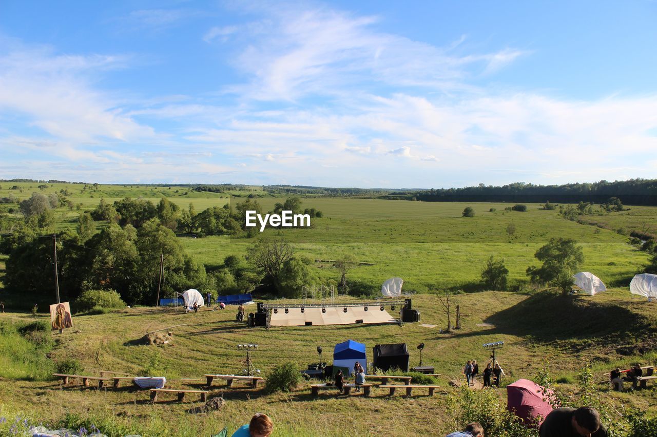 SCENIC VIEW OF AGRICULTURAL FIELD AGAINST BLUE SKY