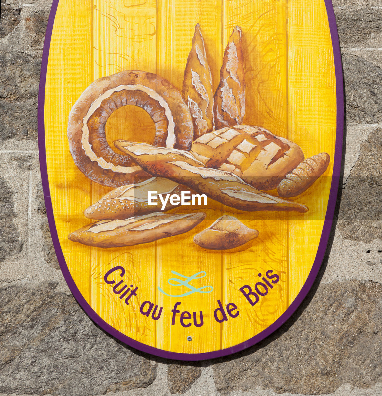 CLOSE-UP OF YELLOW BREAD WITH TEXT