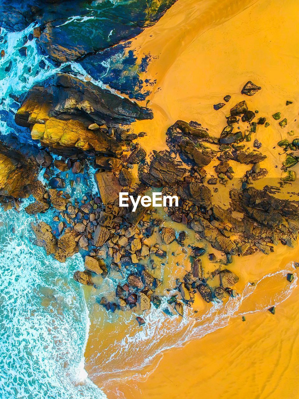 High angle view of rocks at beach