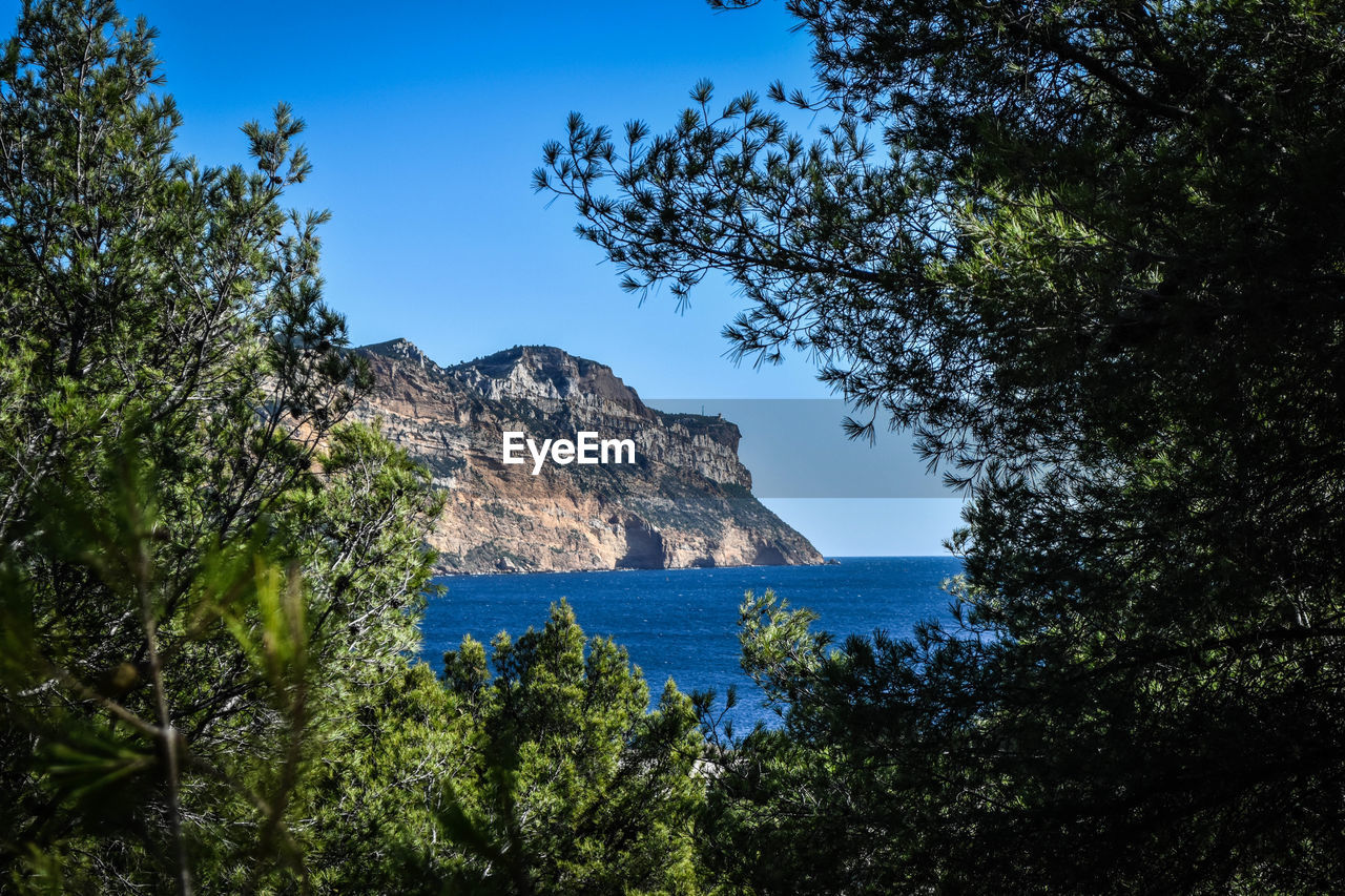 Scenic view of sea against clear blue sky