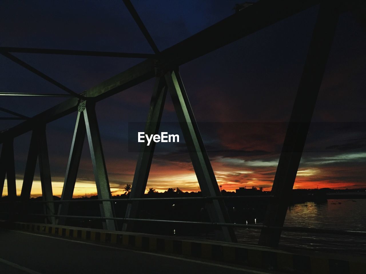 BRIDGE AGAINST SKY AT NIGHT