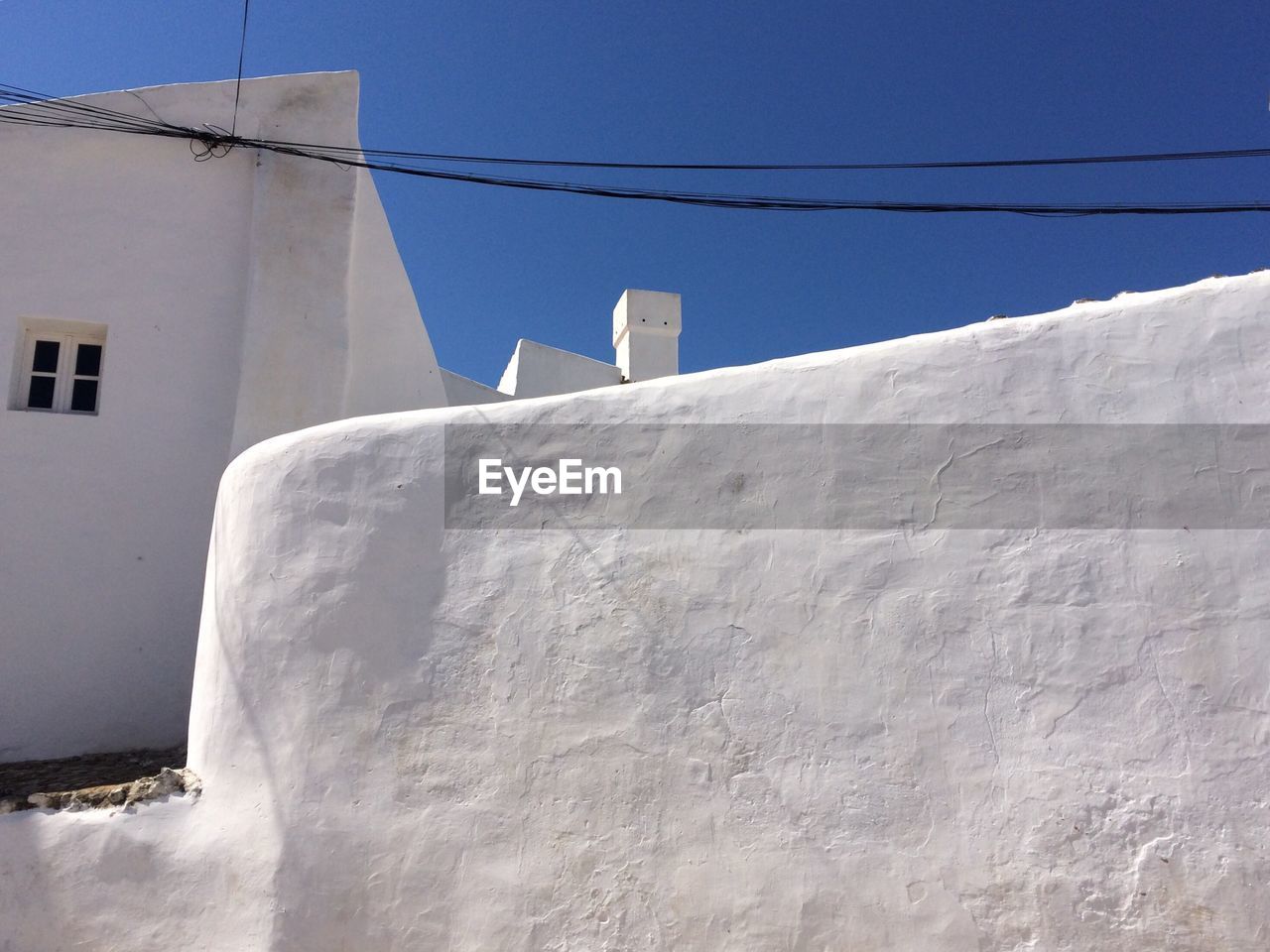Low angle view of house against clear blue sky at santorini