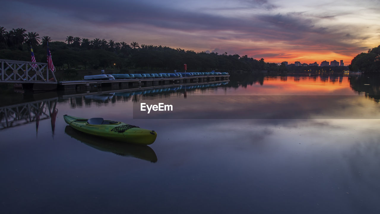 Scenic view of calm lake at sunset