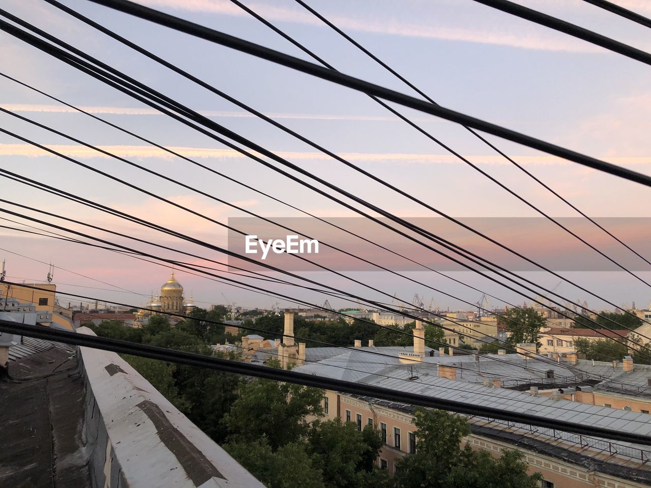 VIEW OF BRIDGE OVER CITY AGAINST SKY