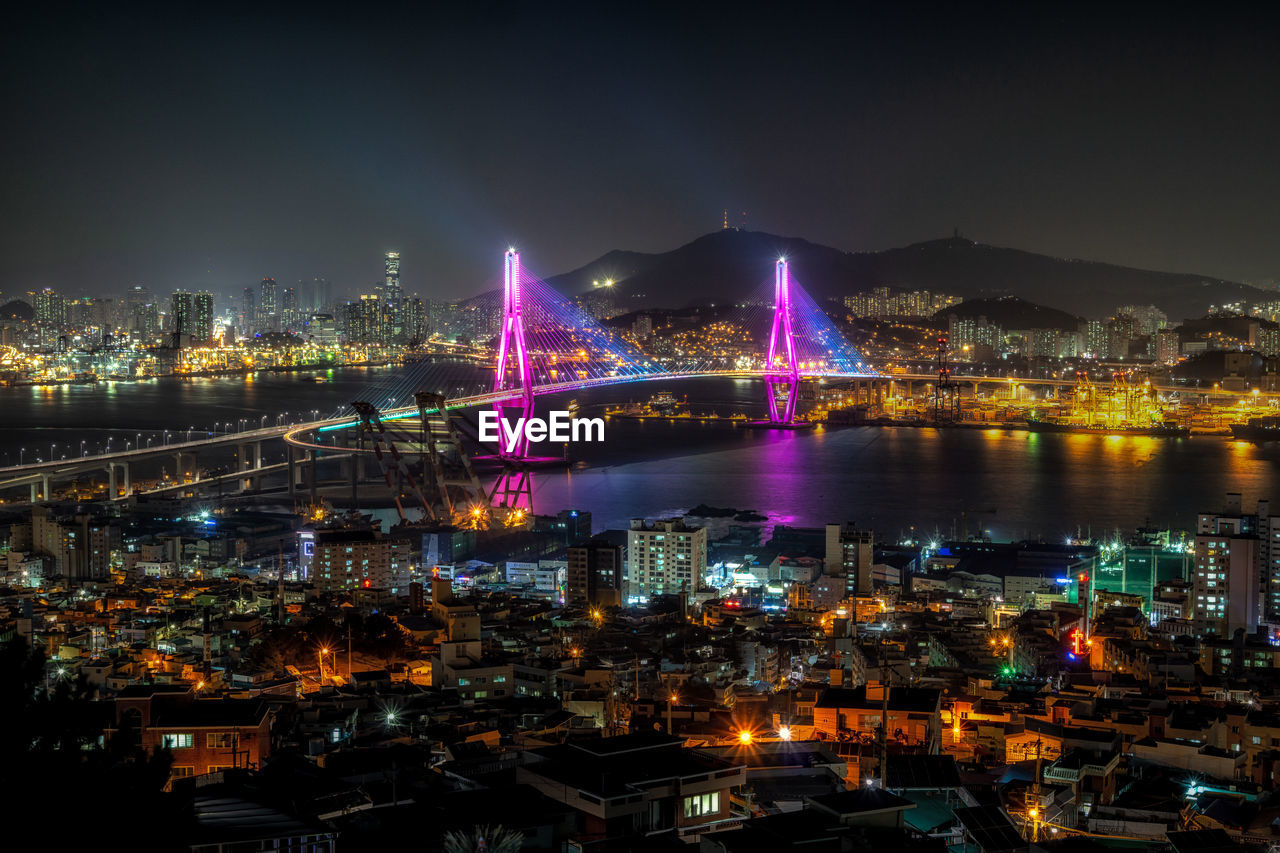 High angle view of illuminated bridge over river at night