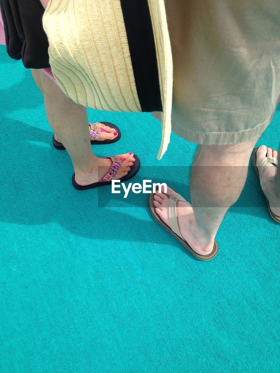 LOW SECTION OF MAN STANDING AT HOME