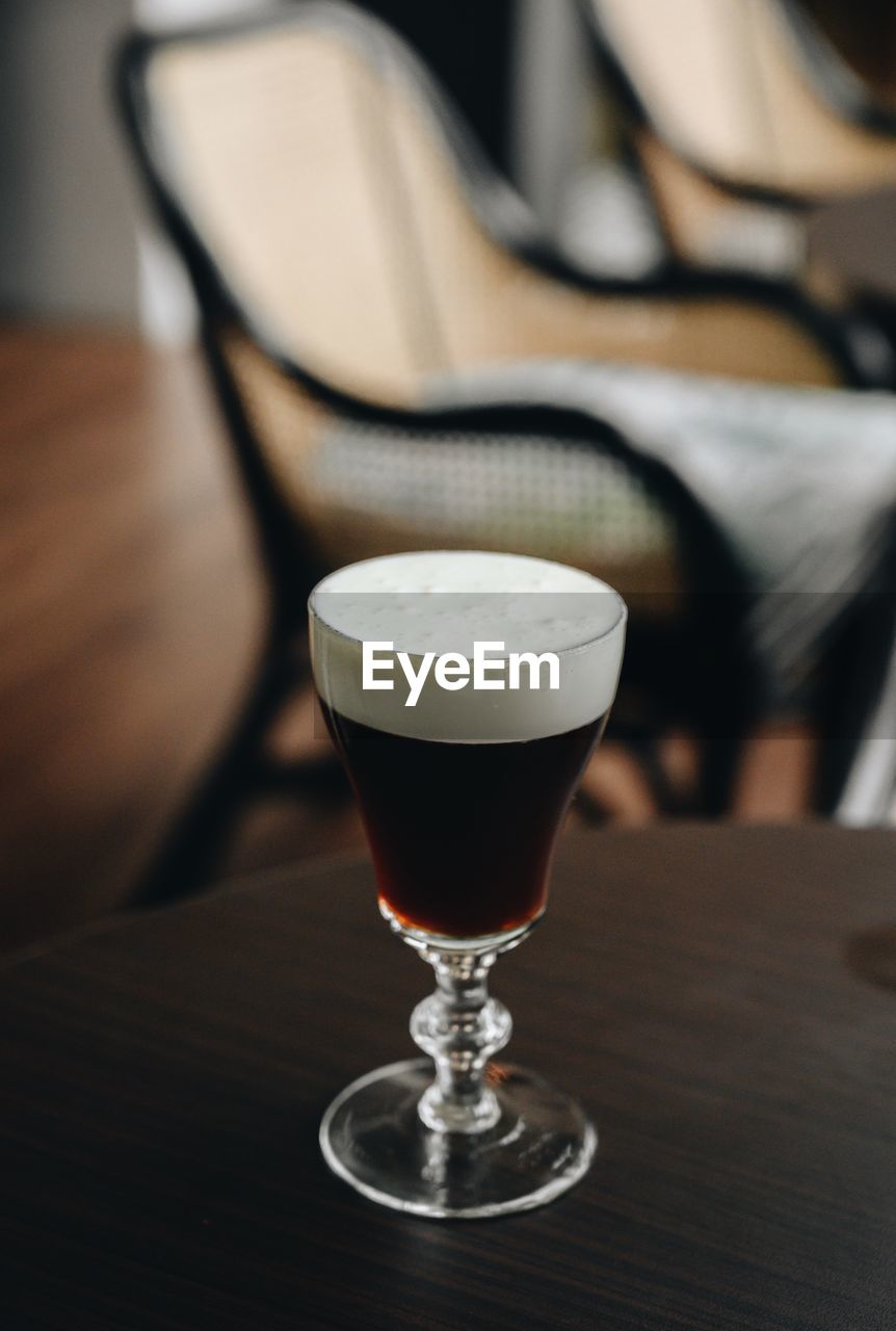 Close-up of wine in glass on table