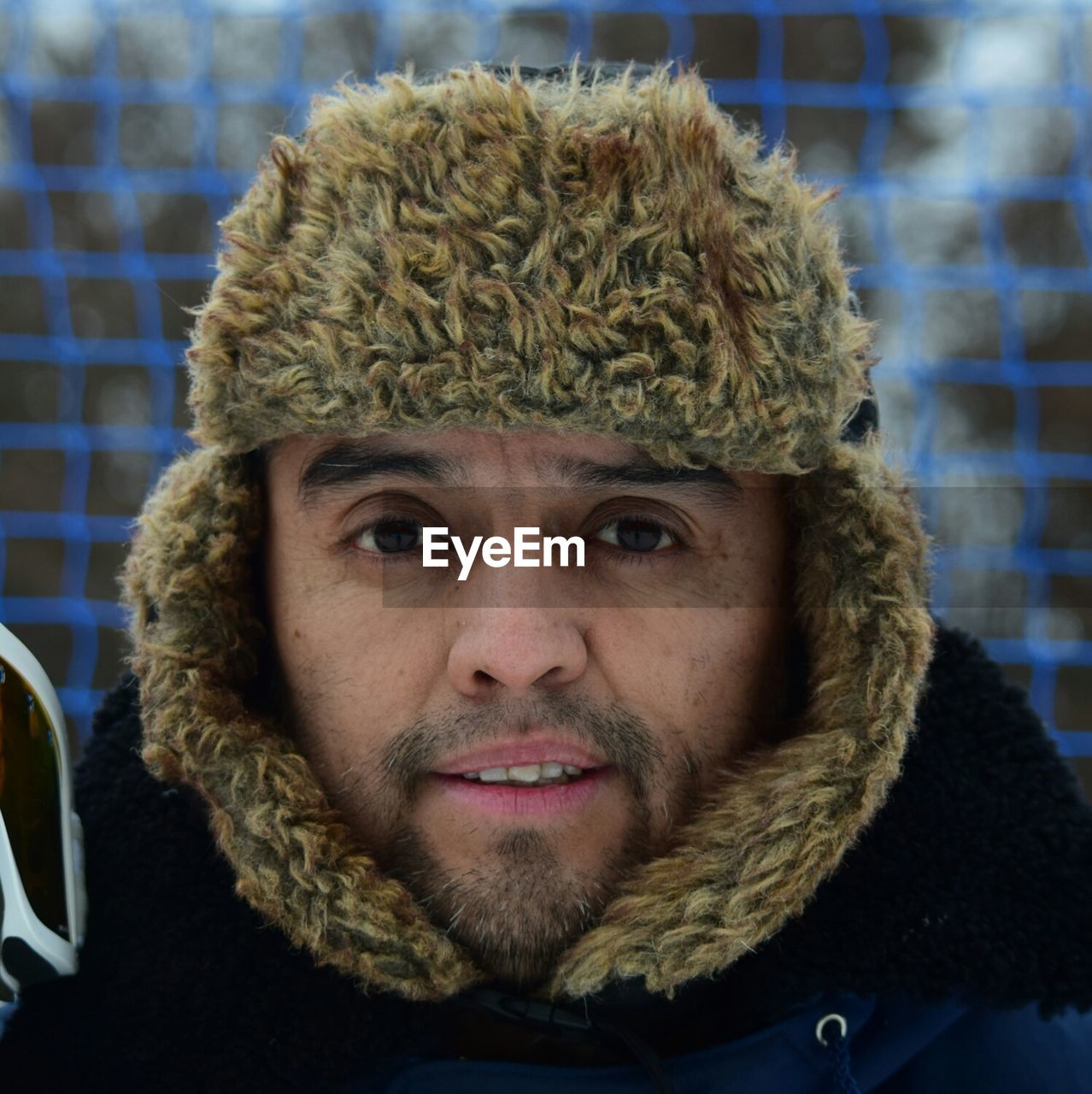 Close-up portrait of man in fur coat