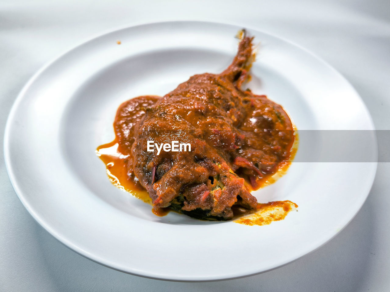 Mackerel stir-fried with dry curry paste called chu chee or raja curry cooked with fish.