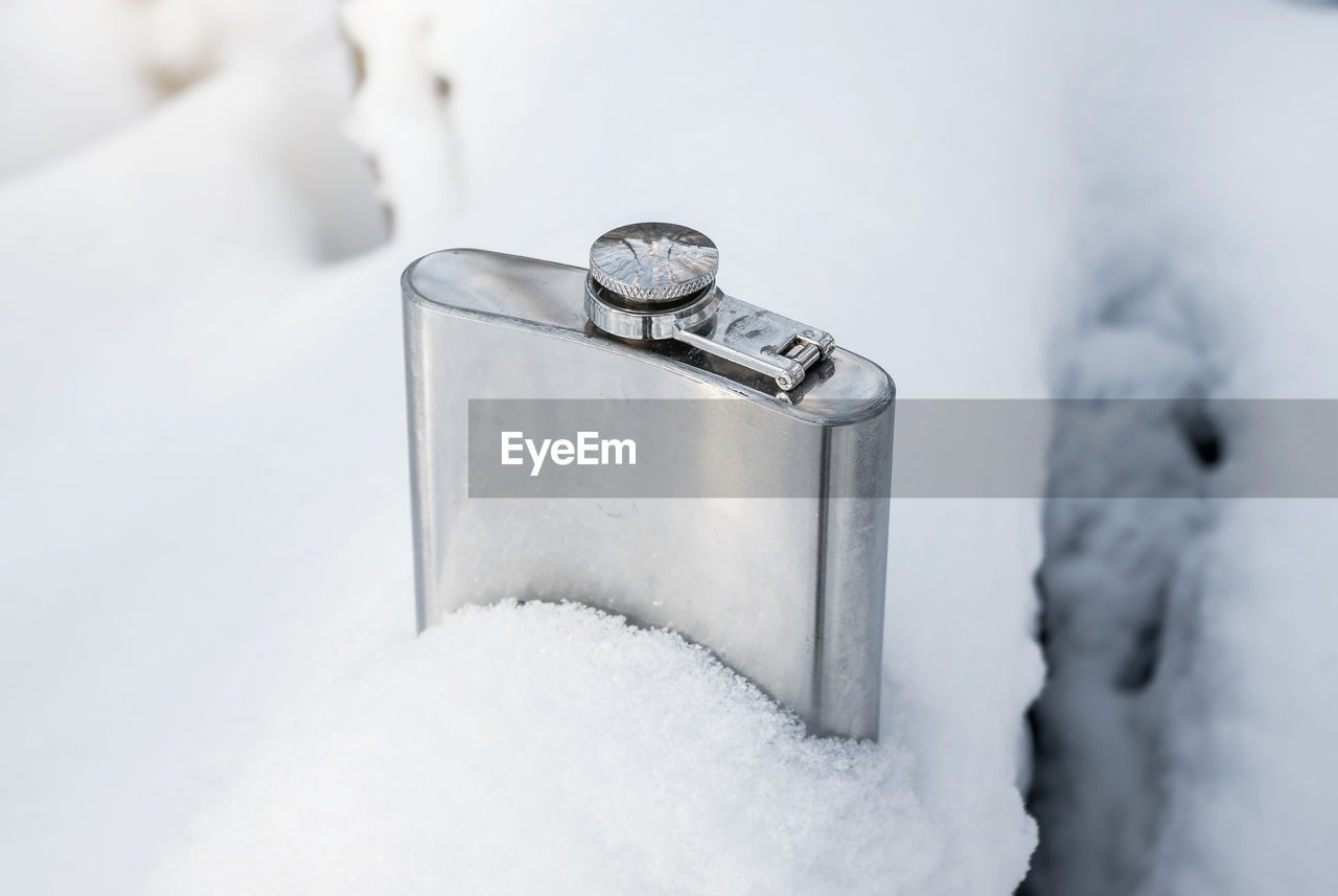 Close-up of snow on metal during winter