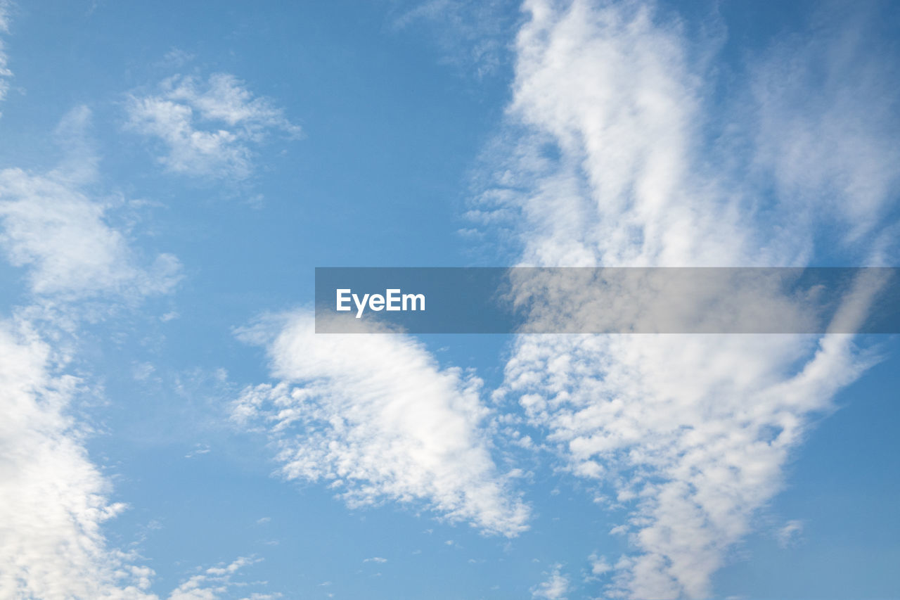 LOW ANGLE VIEW OF CLOUDS IN BLUE SKY