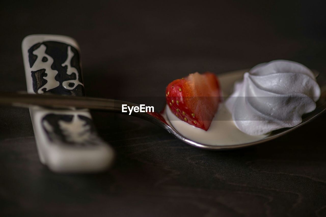 Close-up of eton mess on spoon