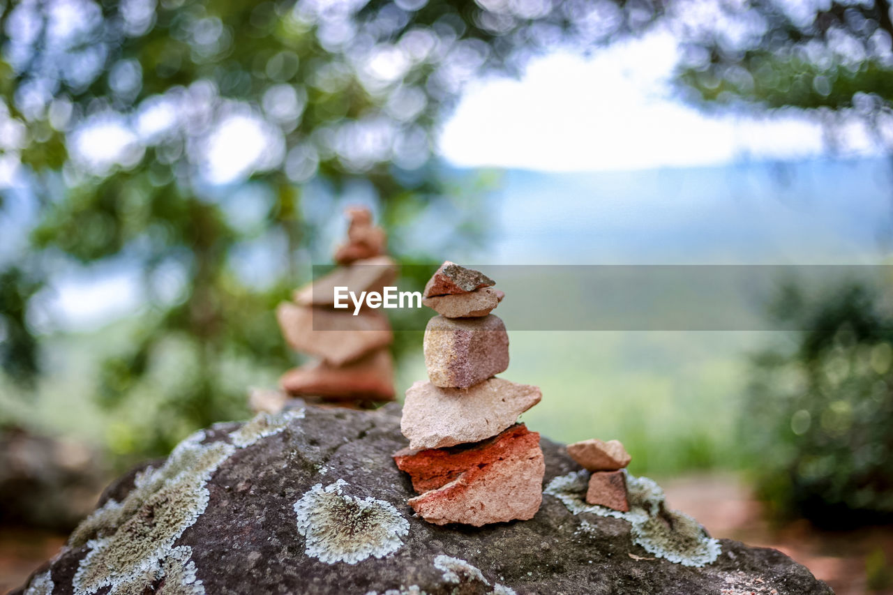 Close-up of stones stacked on rock