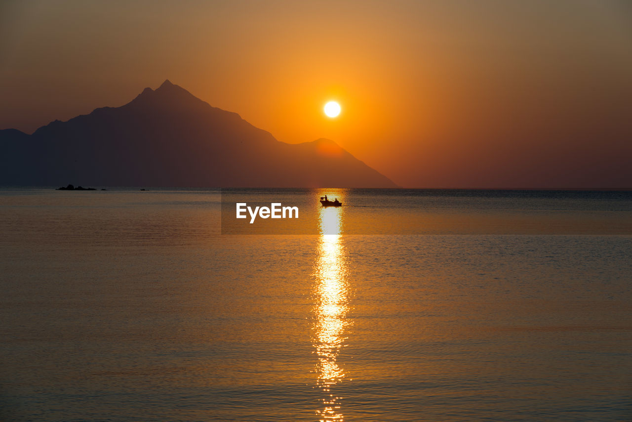 Scenic view of sea against sky during sunset