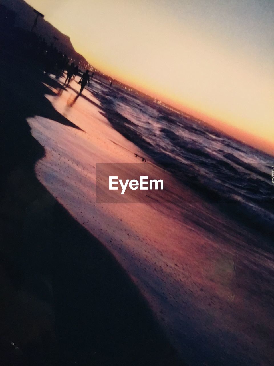 SCENIC VIEW OF BEACH DURING SUNSET