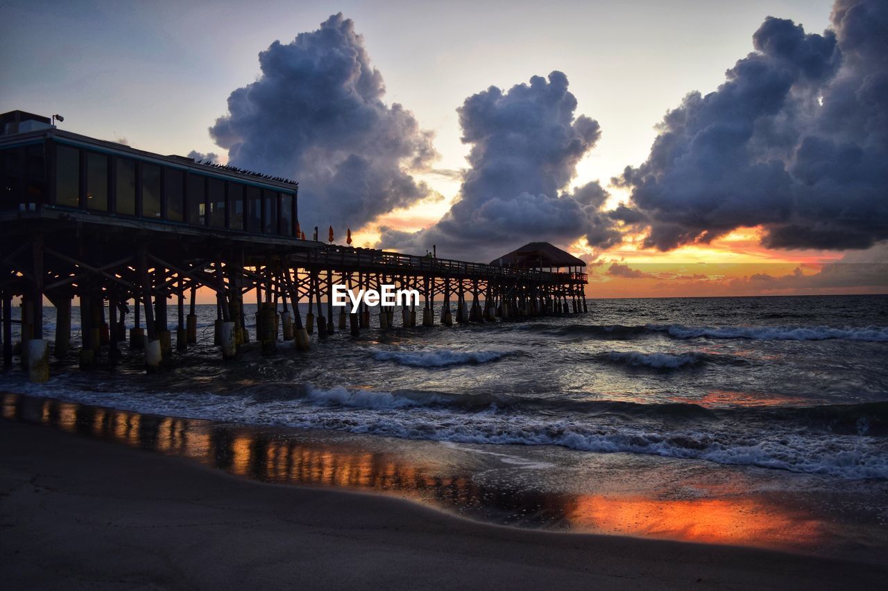 PIER ON SEA AGAINST SKY DURING SUNSET