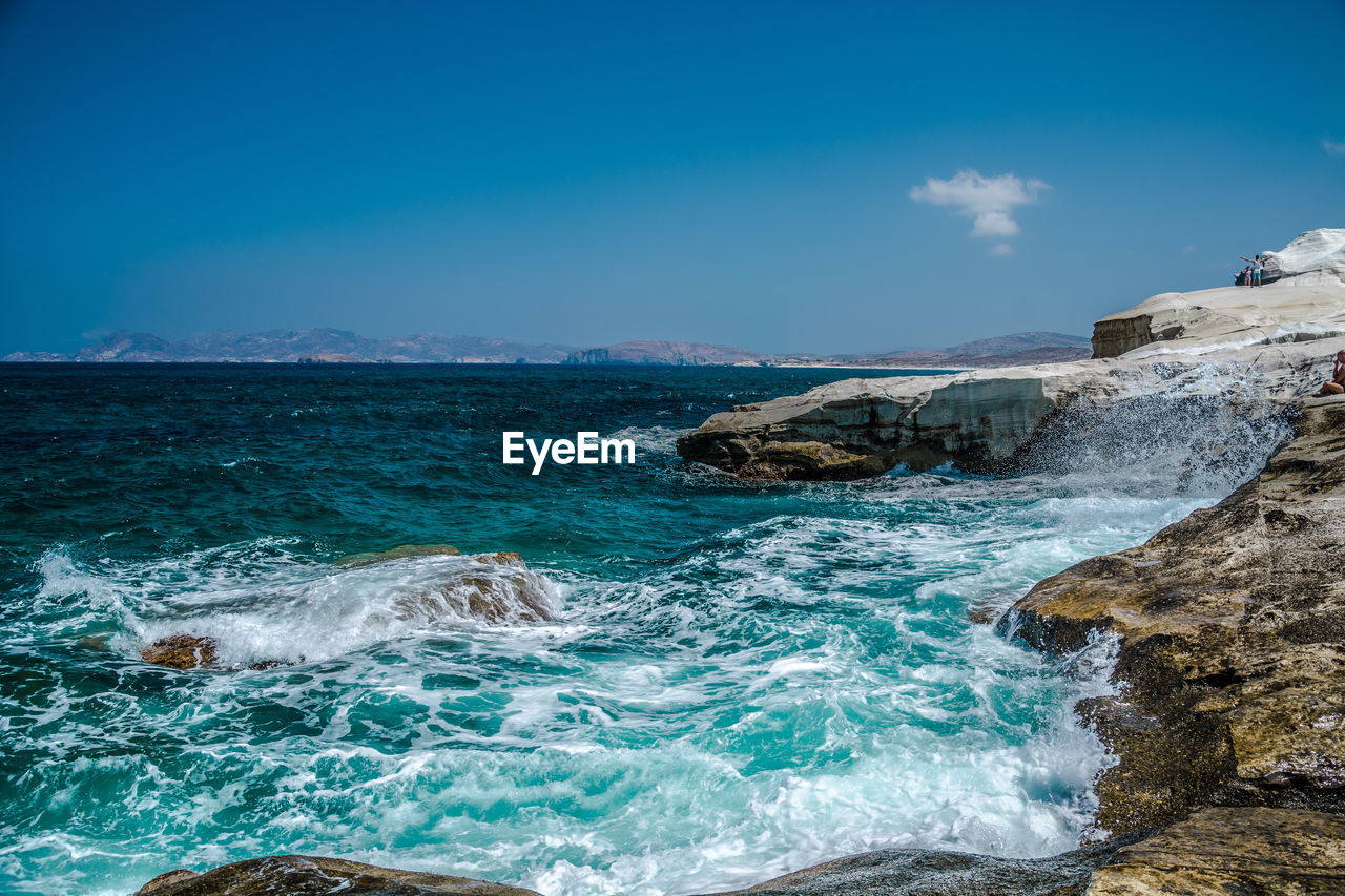 Scenic view of sea against blue sky