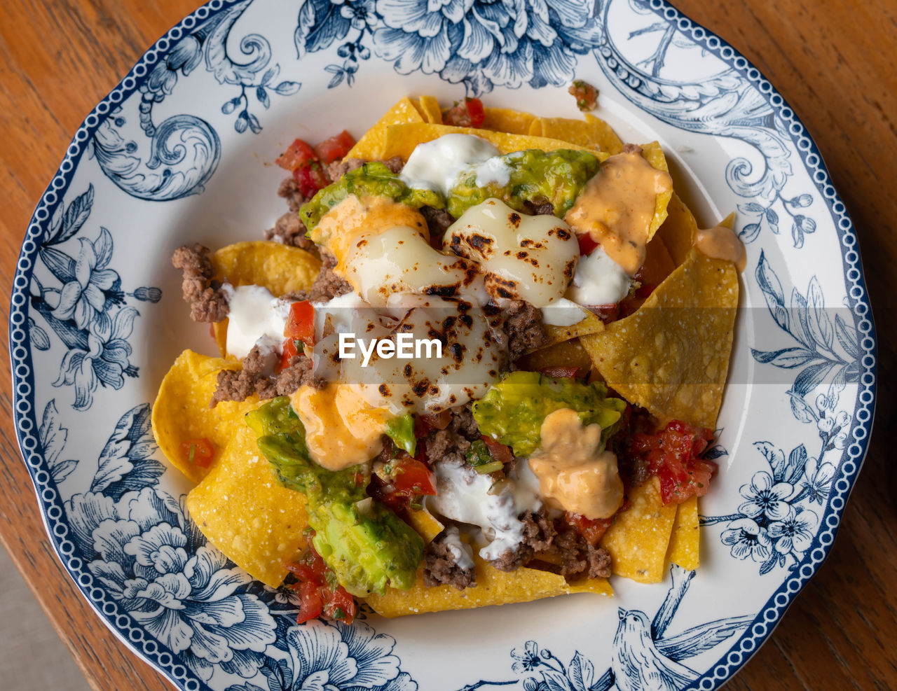 High angle view of nachos mexican food in plate on table
