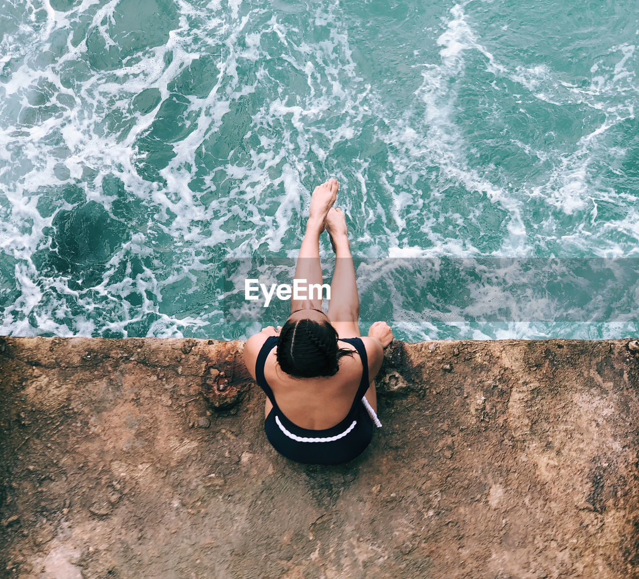 HIGH ANGLE VIEW OF PERSON RELAXING IN SEA