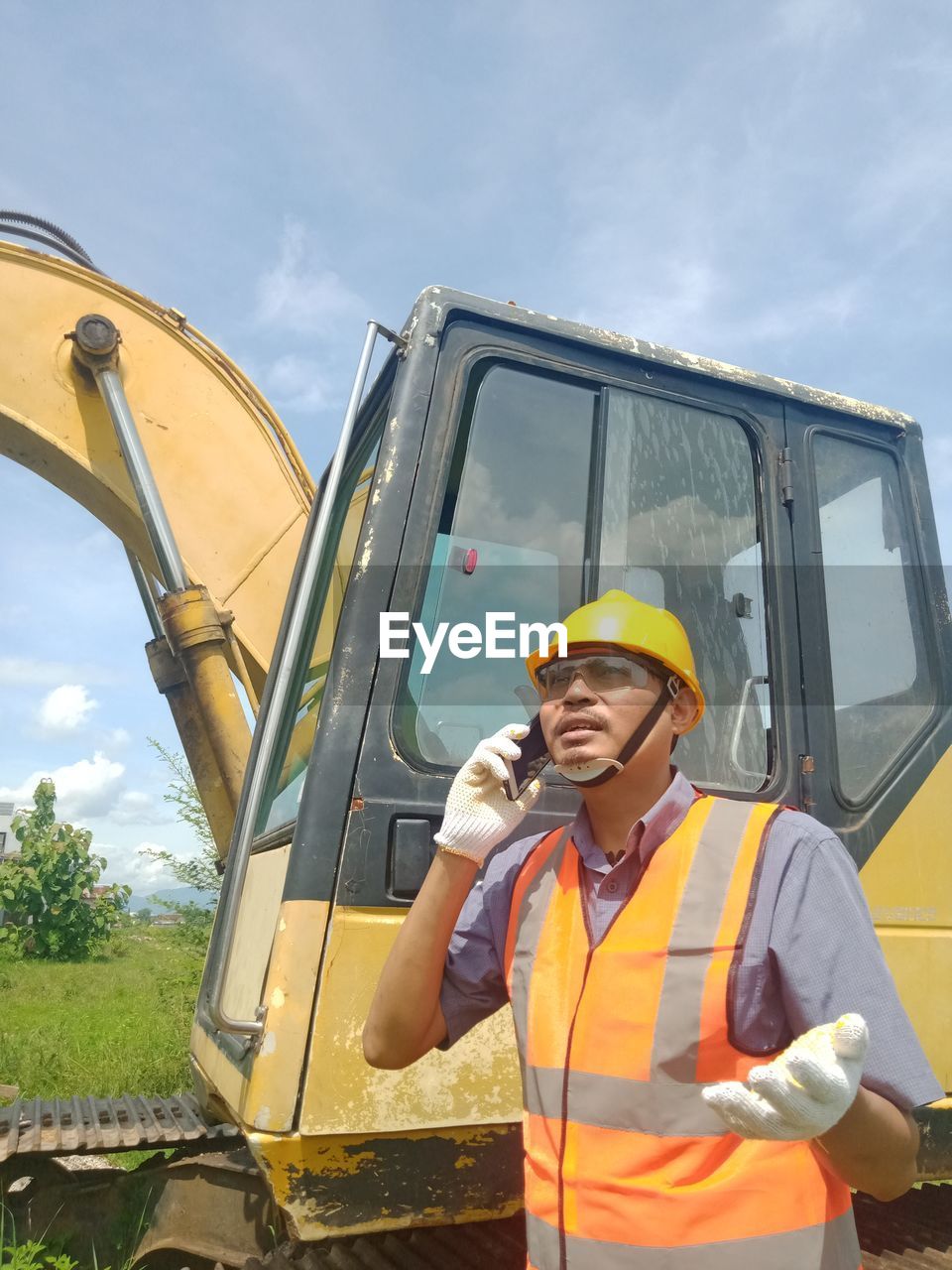 MAN WORKING AGAINST YELLOW