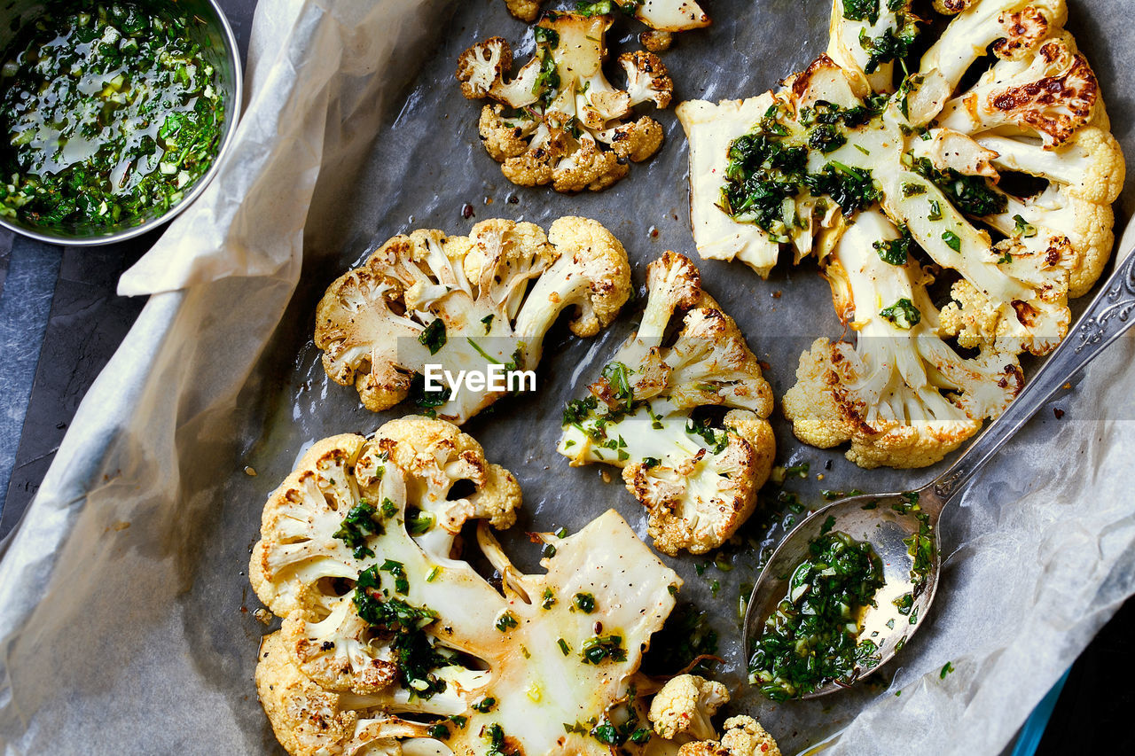 Cauliflower steaks with a cilantro lime chimichurri. plant based meat substitute