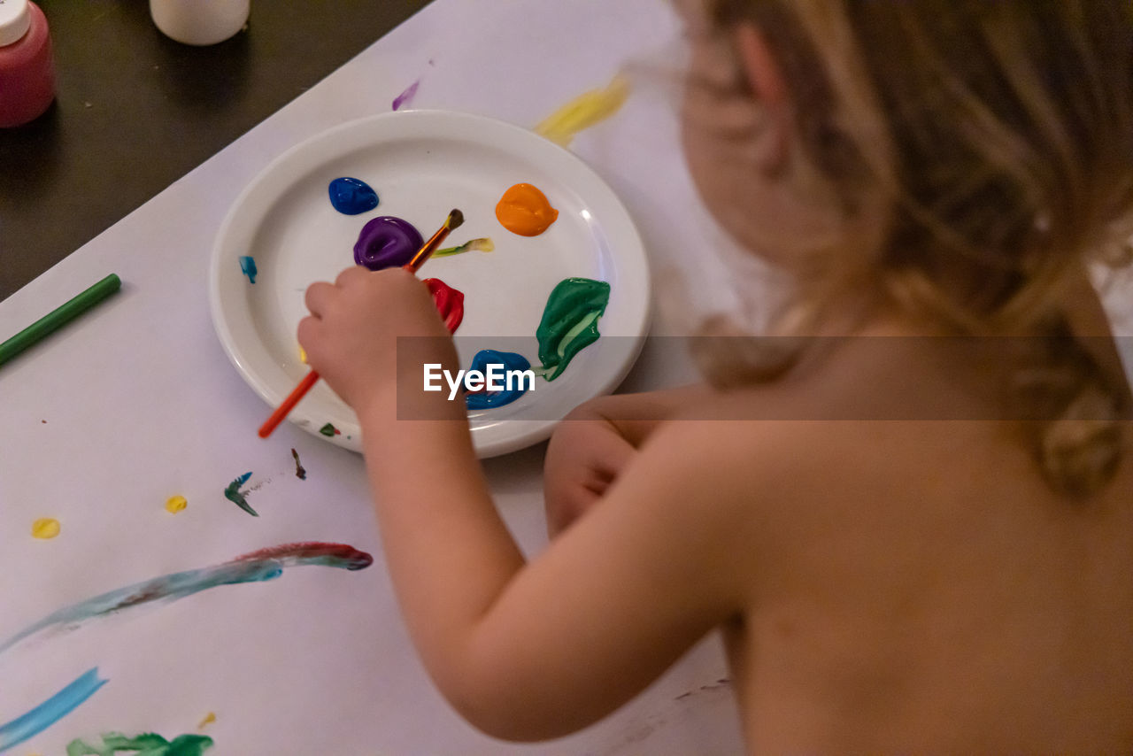 high angle view of girl painting