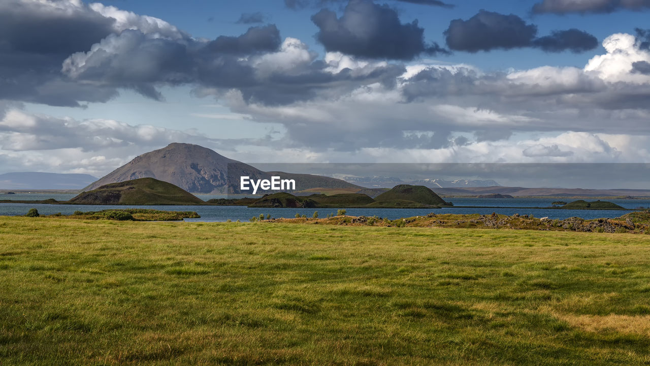 SCENIC VIEW OF FIELD AGAINST CLOUDY SKY