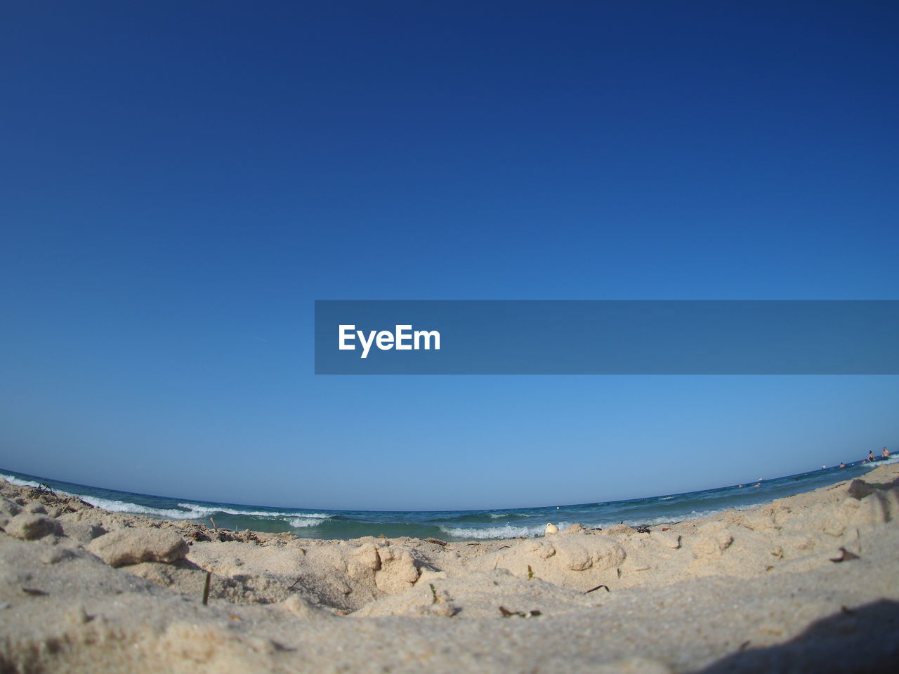 SCENIC VIEW OF BEACH AGAINST CLEAR SKY