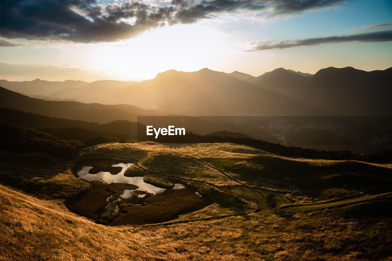 scenic view of landscape against sky during sunset