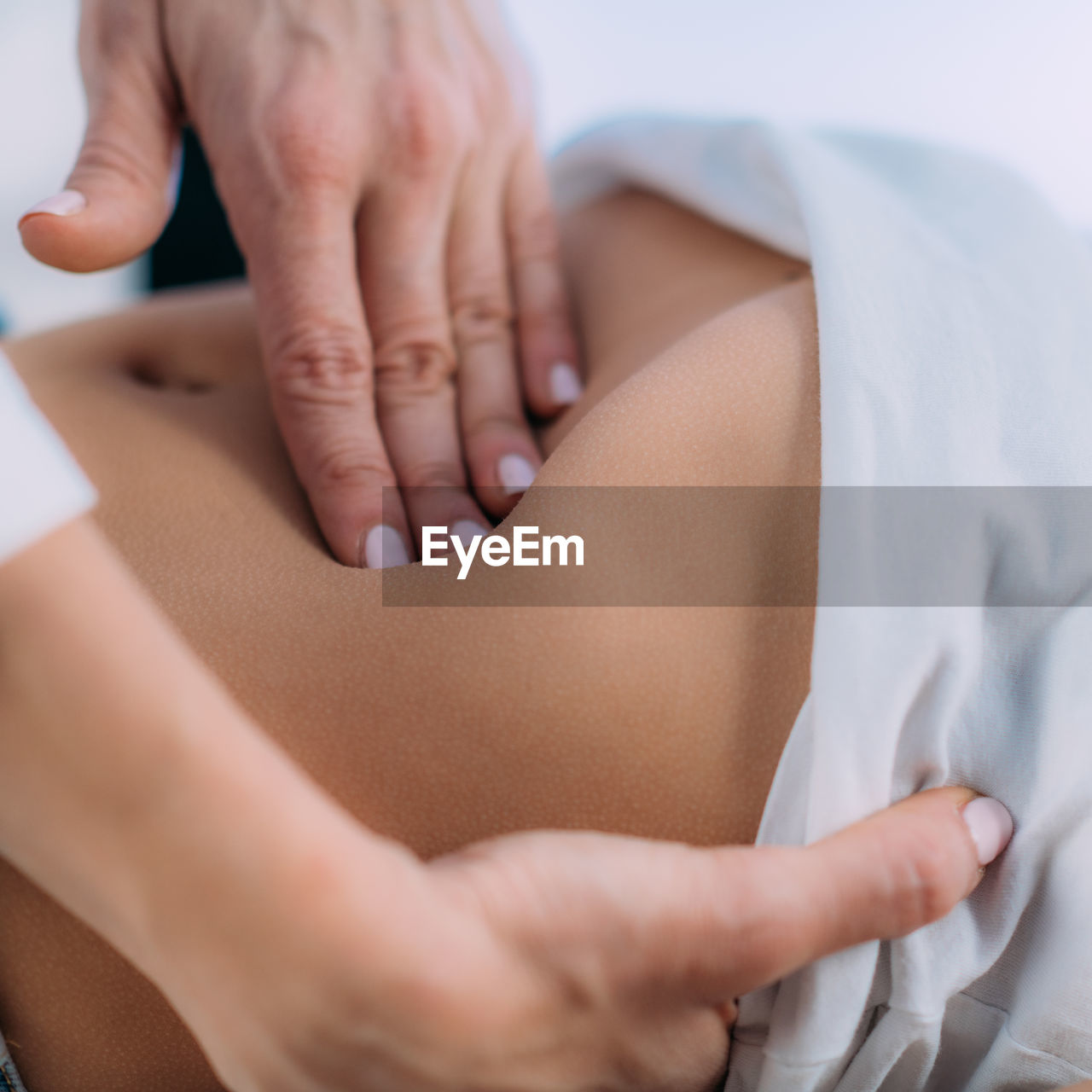 Pediatrician gastroenterologist, doing abdominal examination to a preschooler boy