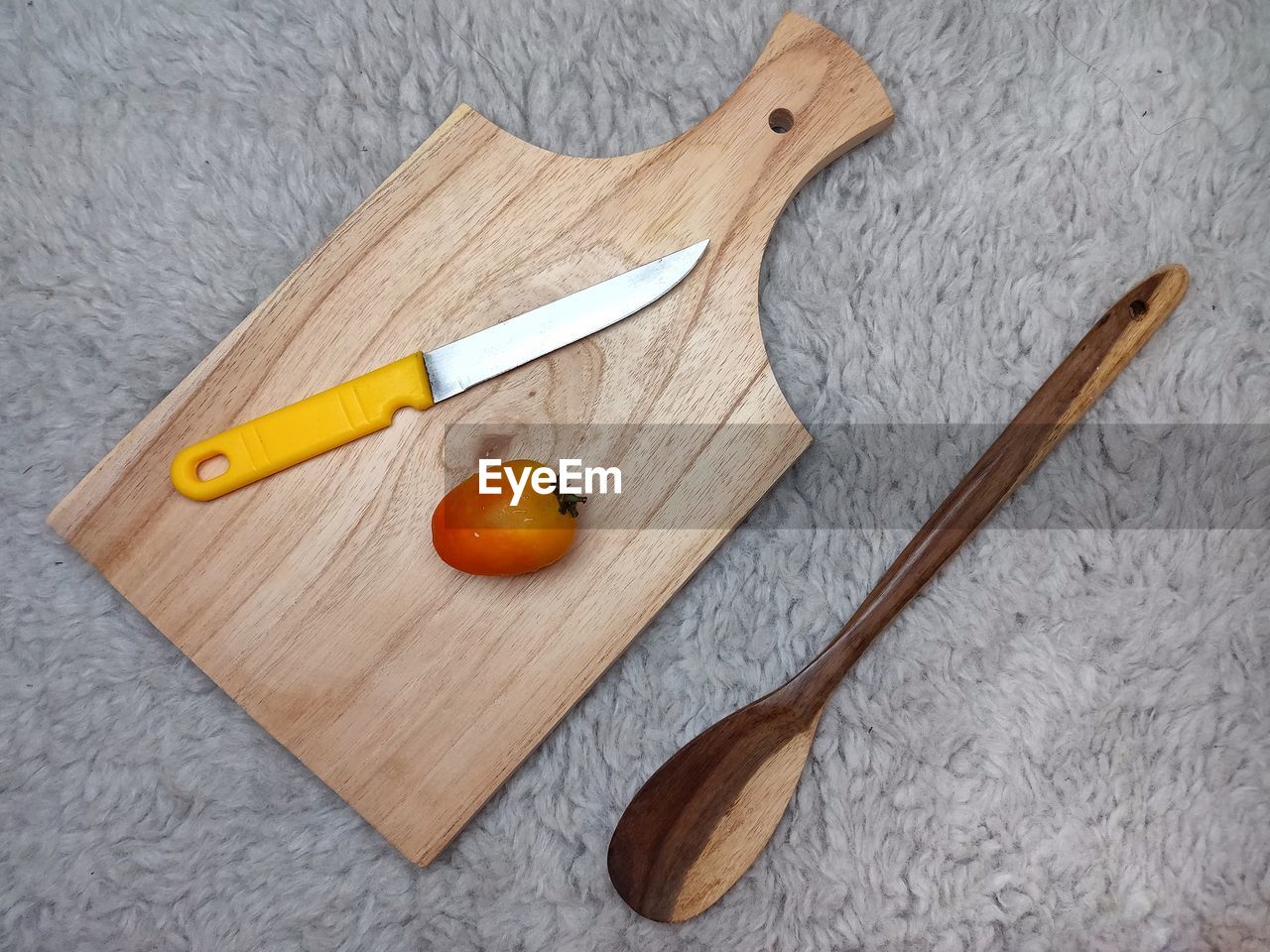 High angle view of tomato on cutting board