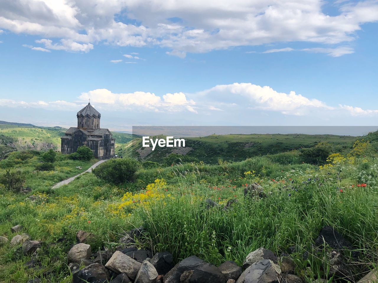 PANORAMIC VIEW OF TEMPLE ON BUILDING BY LAND AGAINST SKY