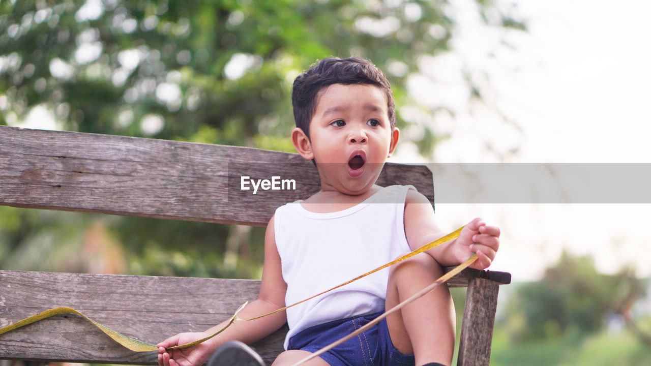 Cute boy looking away outdoors