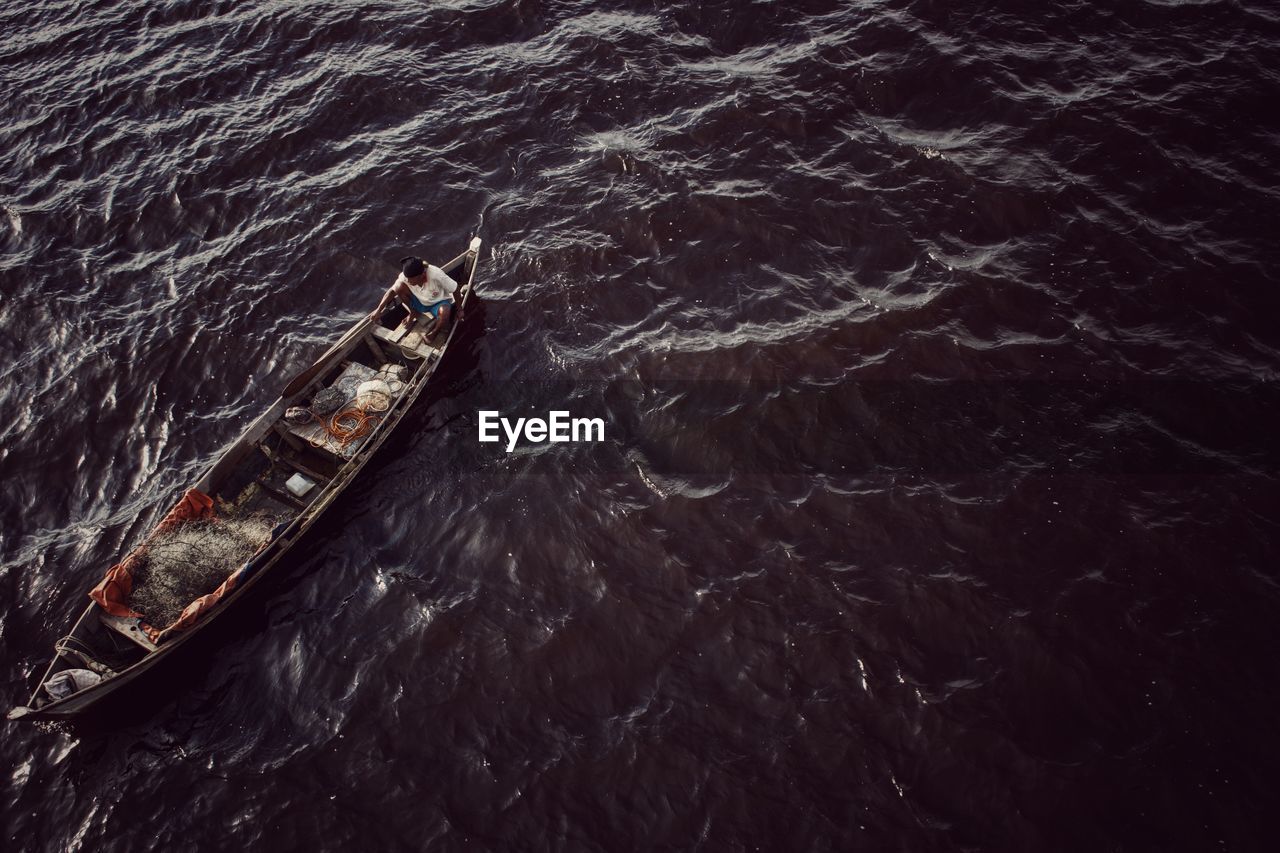 High angle view of boat sailing in sea