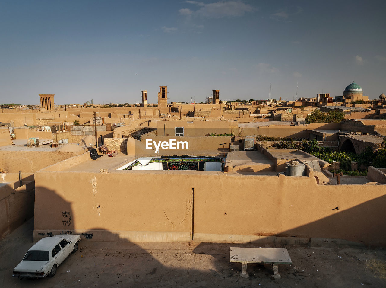 View of old buildings in city against sky