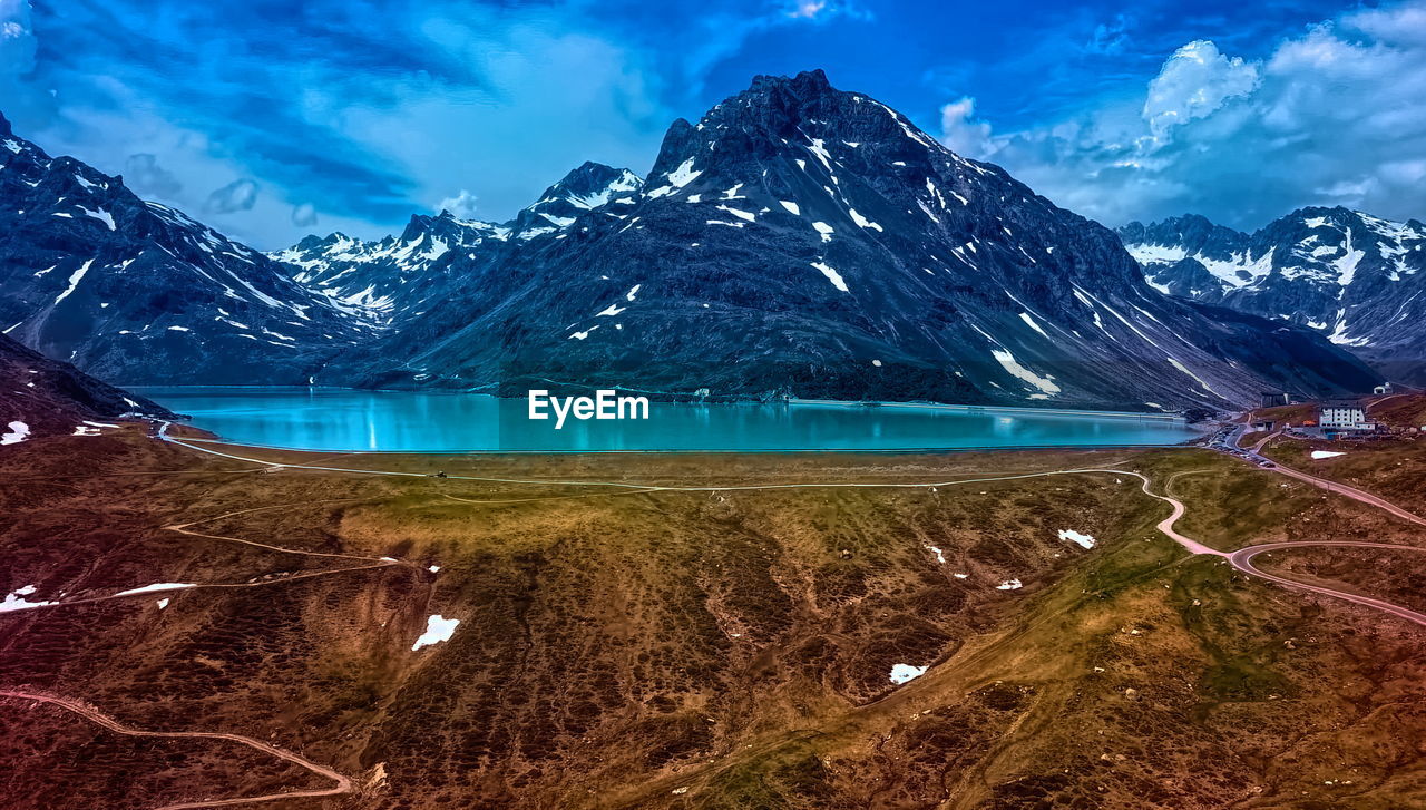 Scenic view of snowcapped mountains against sky during winter