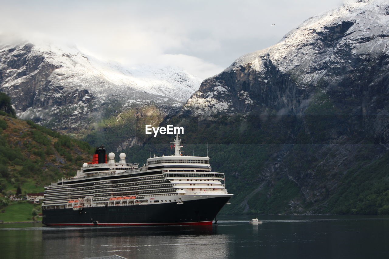 SCENIC VIEW OF SNOWCAPPED MOUNTAINS AND LAKE