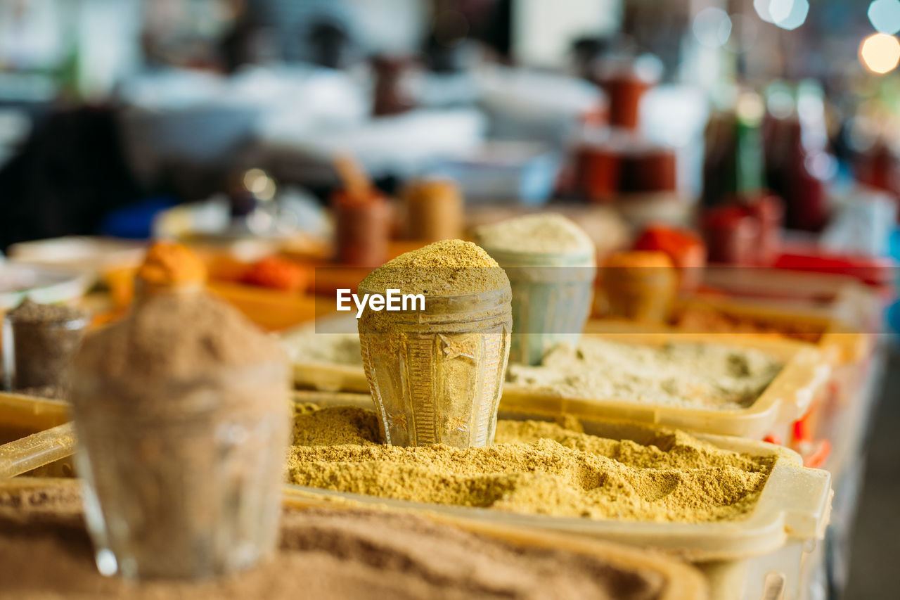 Close-up of spices for sale in container at market