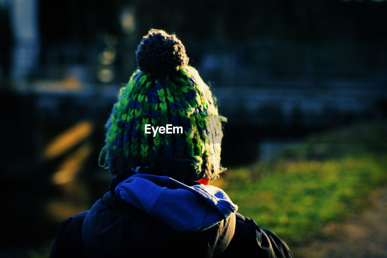 Rear view of woman wearing knit hat