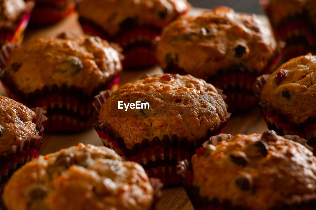 Appetizing homemade muffins on a wooden cutting board. traditional festive christmas baking.